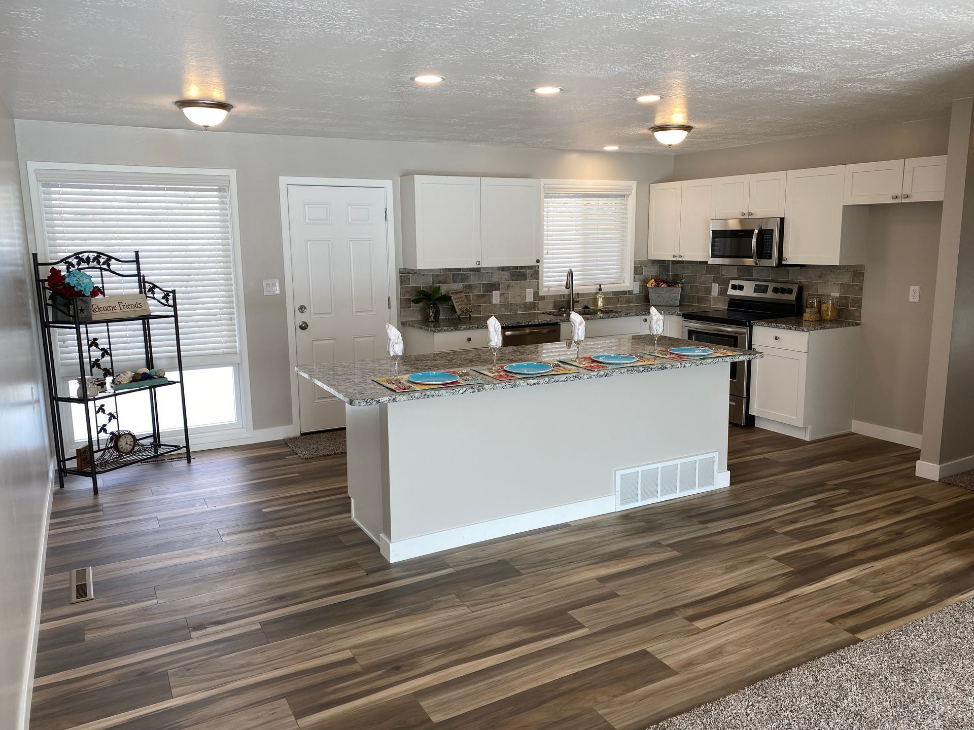 A kitchen with a large island in the middle of the room.