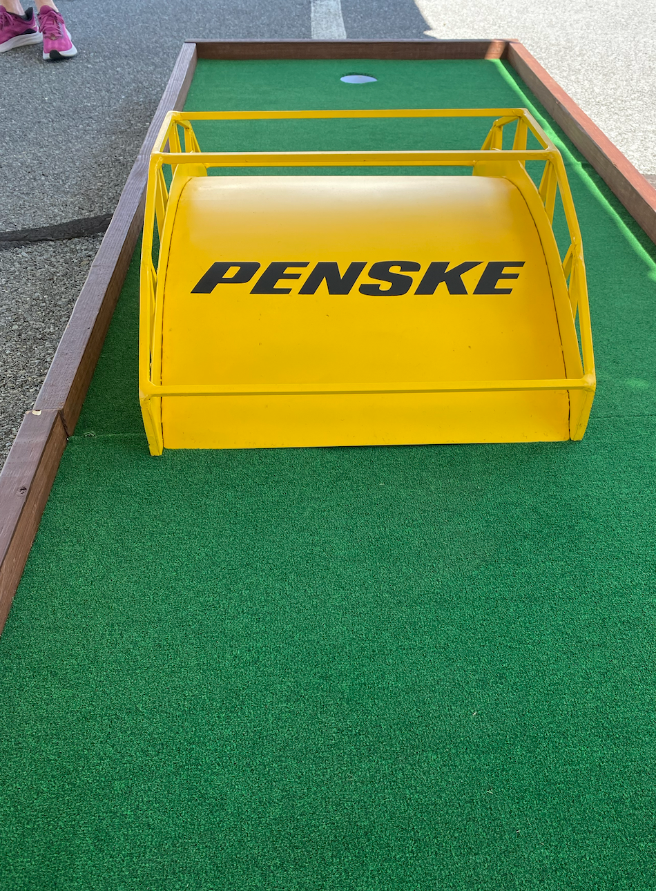A yellow tray with the word penske on it