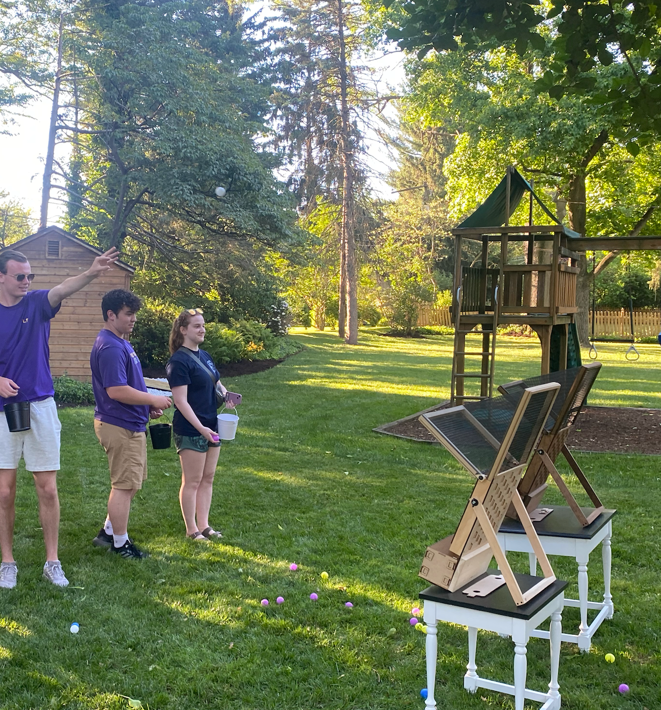 A group of people are playing a game in a park