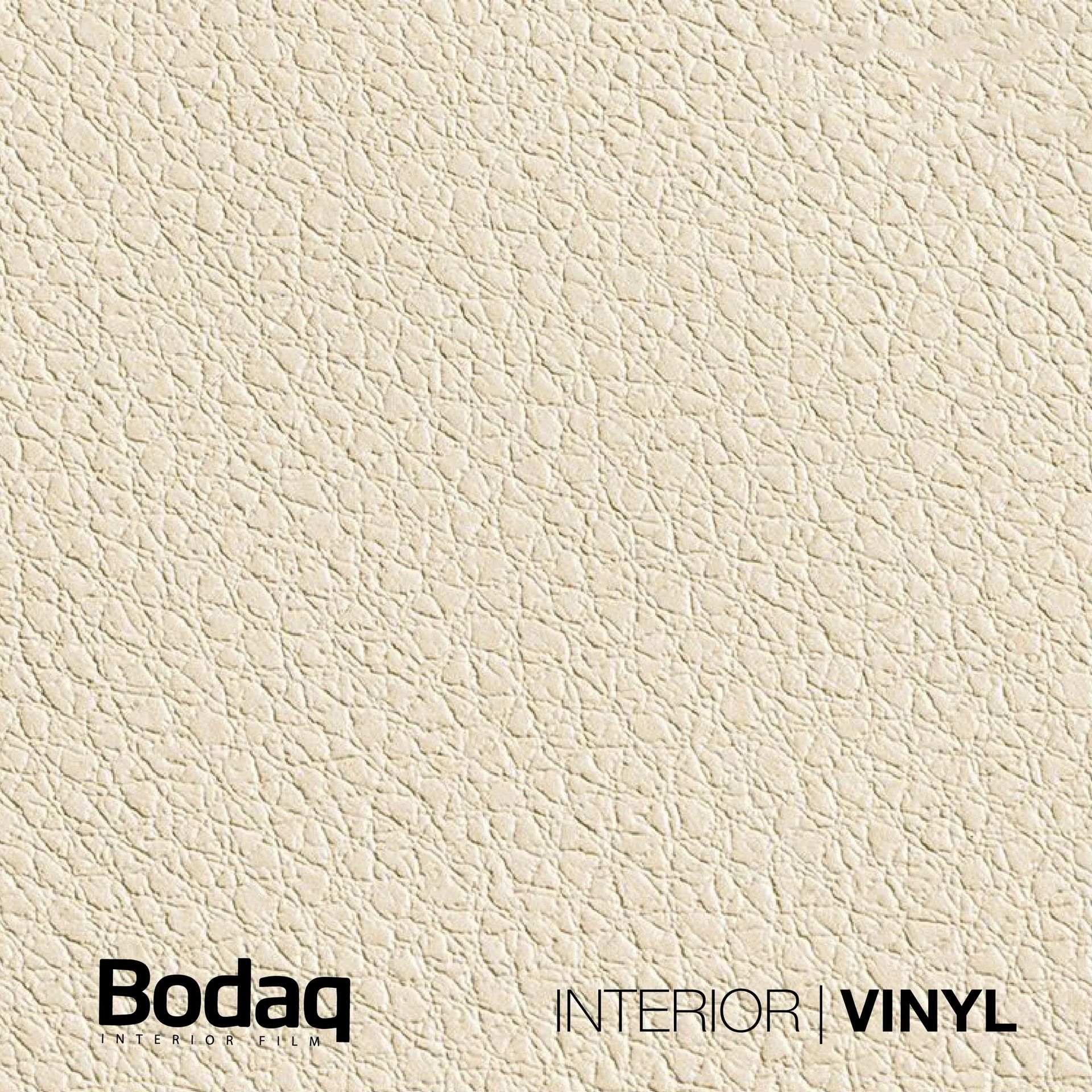 Een close-up van een crèmekleurig, gestructureerd Bodaq vinyl interieuroppervlak met leernerfstructuur.