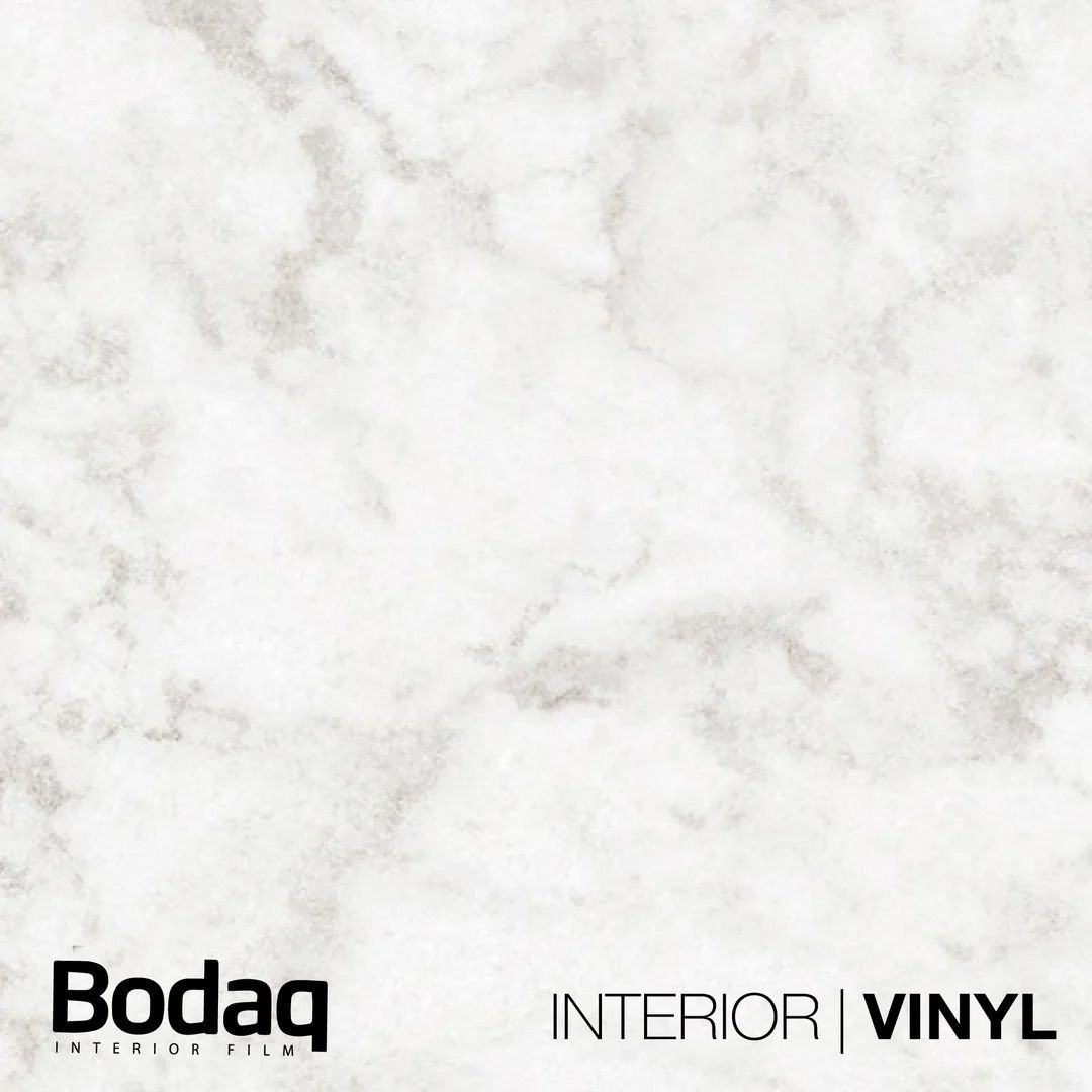 Een voorbeeld van een wit marmerpatroon met het Bodaq Interior Vinyl-logo in de linkerbenedenhoek.