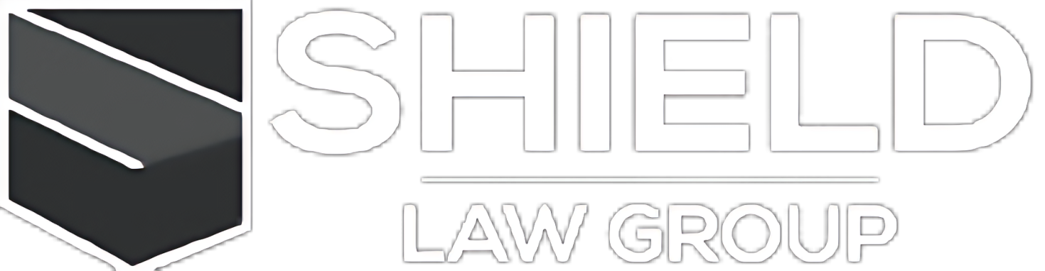 The logo for the shield law group is a black and white logo with a shield on it.