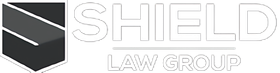 The logo for the shield law group is a black and white logo with a shield on it.