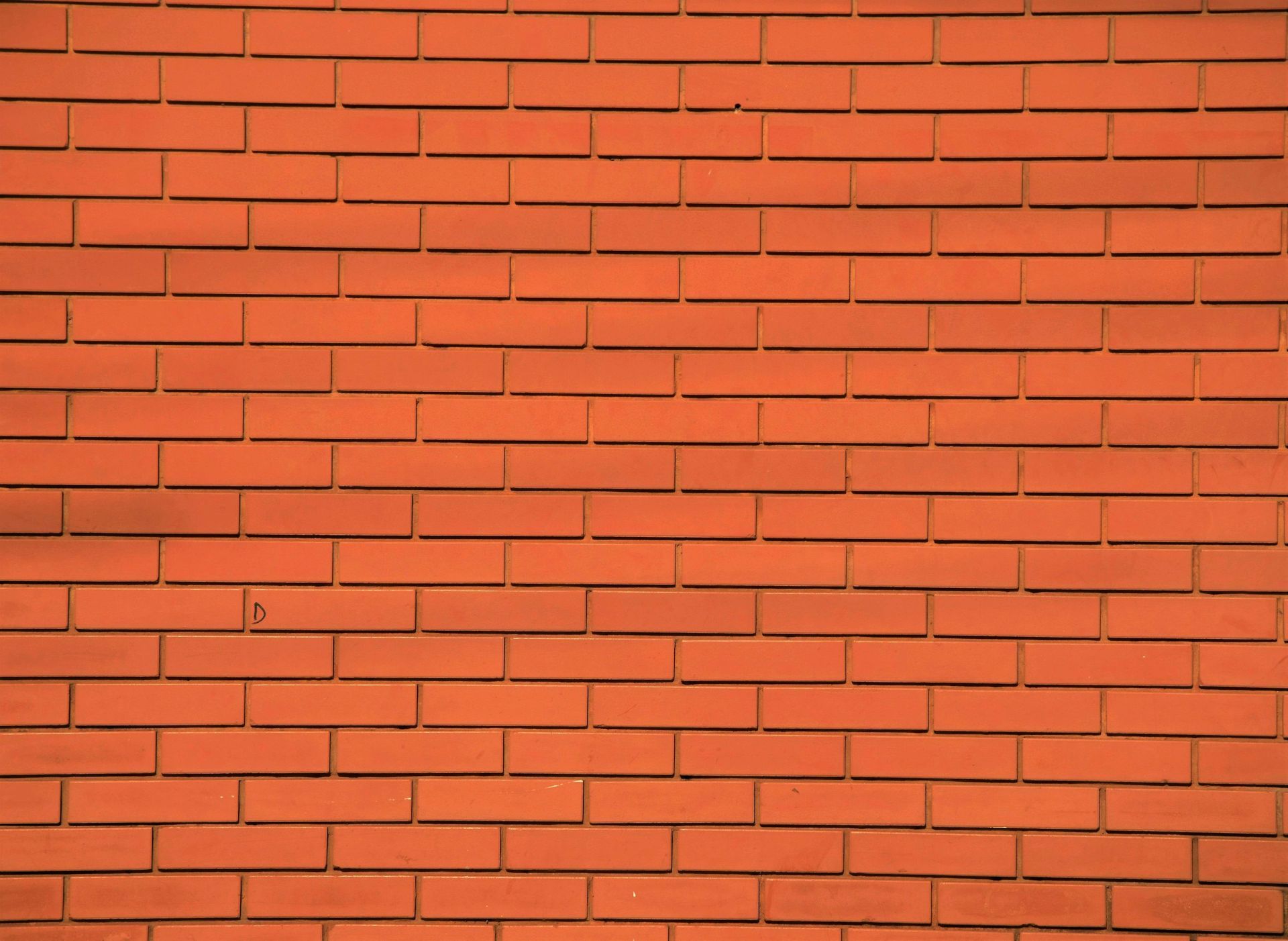 A close up of a red brick wall.