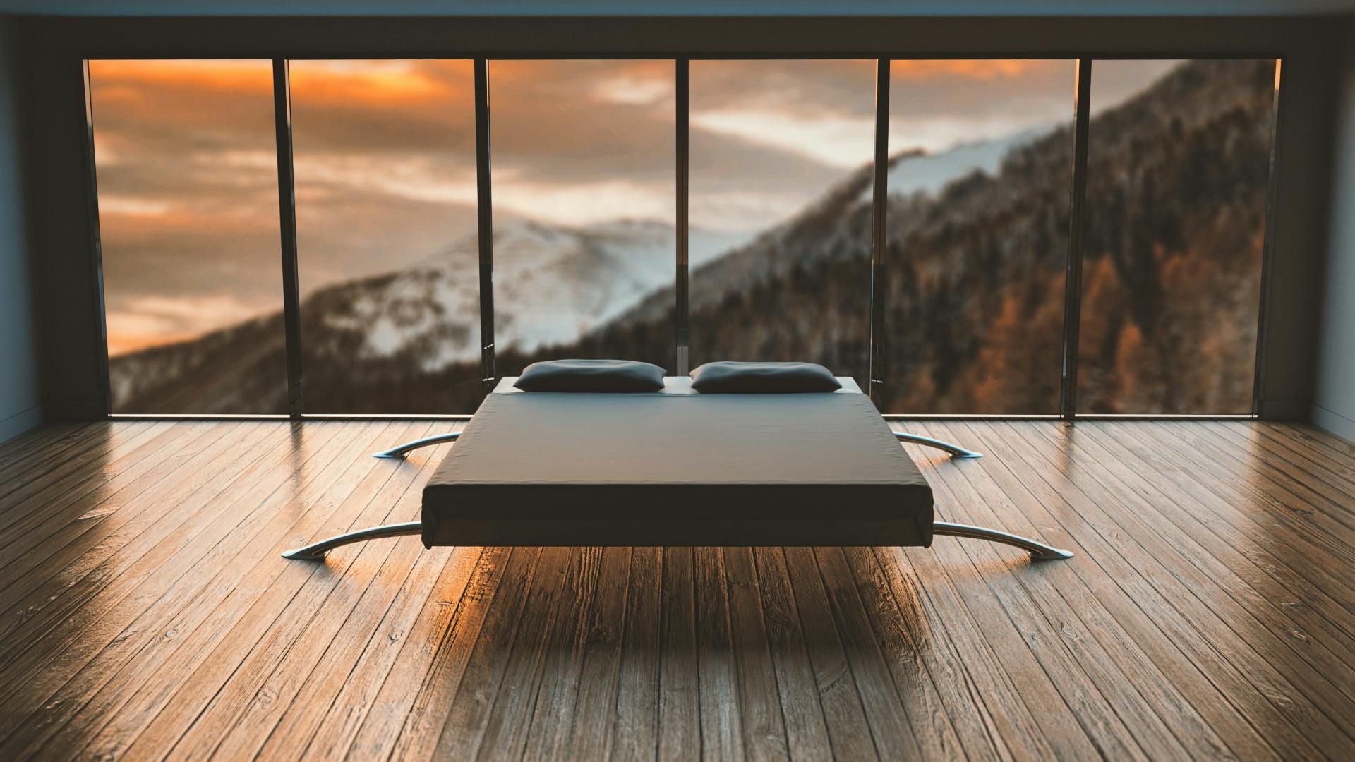 There is a bed in the middle of the room with a view of the mountains.