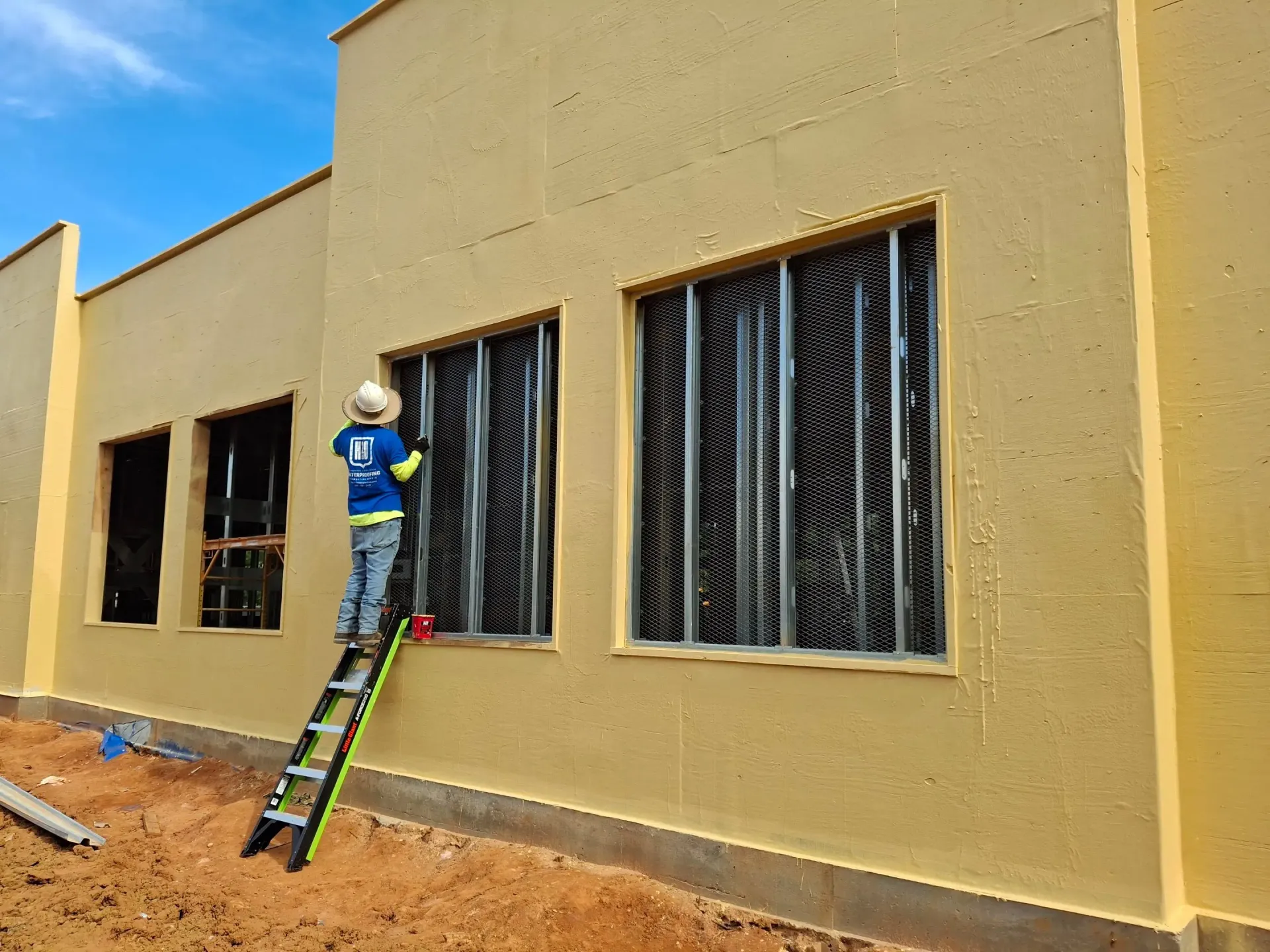 H2O Waterproofing workers commercial waterproofing project on Alabama new bank building.