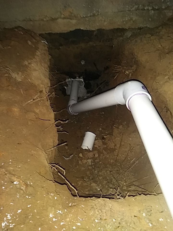 drain discharge that is a white pipe attached to a pump