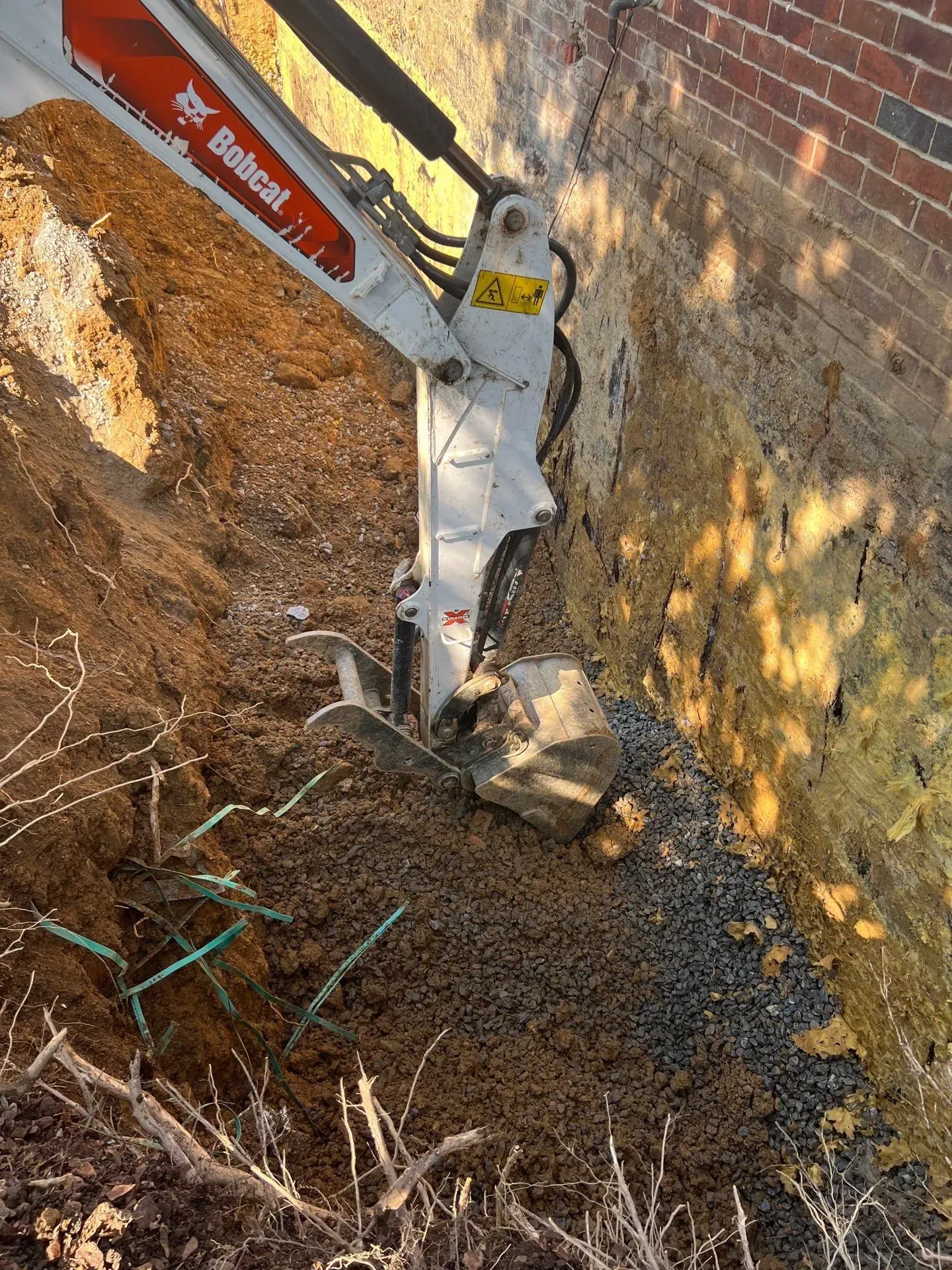 Exterior basement waterproofing excavation by H2O Waterproofing in Alabama, foundation wall exposed to footer