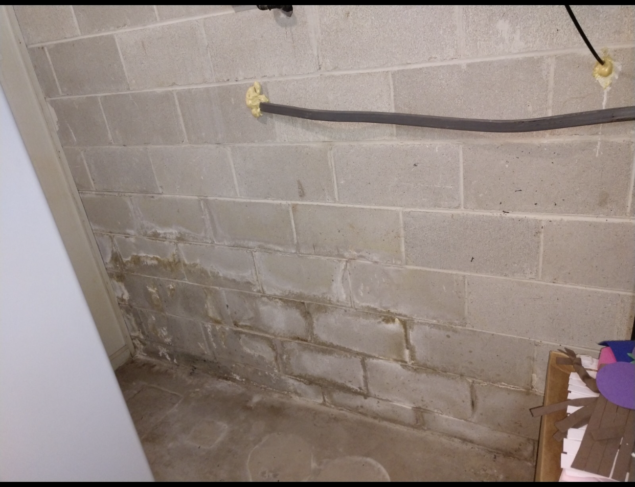 Water putting pressure on basement walls and causing cracks where water can seep in