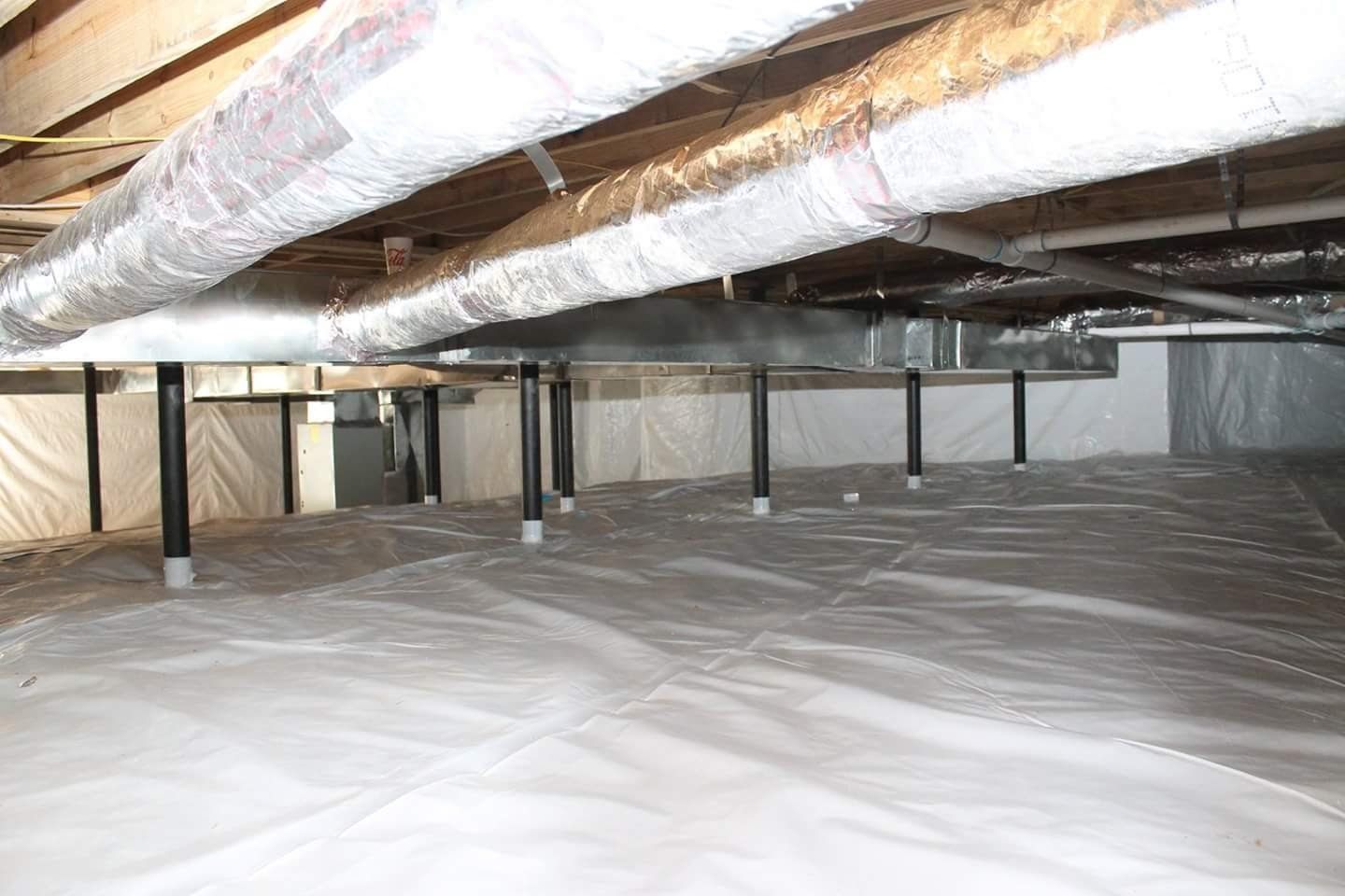 Crawl space encapsulation with a vapor barrier in a homes crawl space
