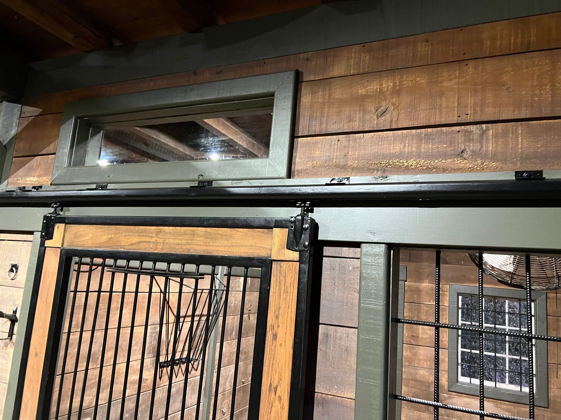 A wooden building with a sliding door and a window.