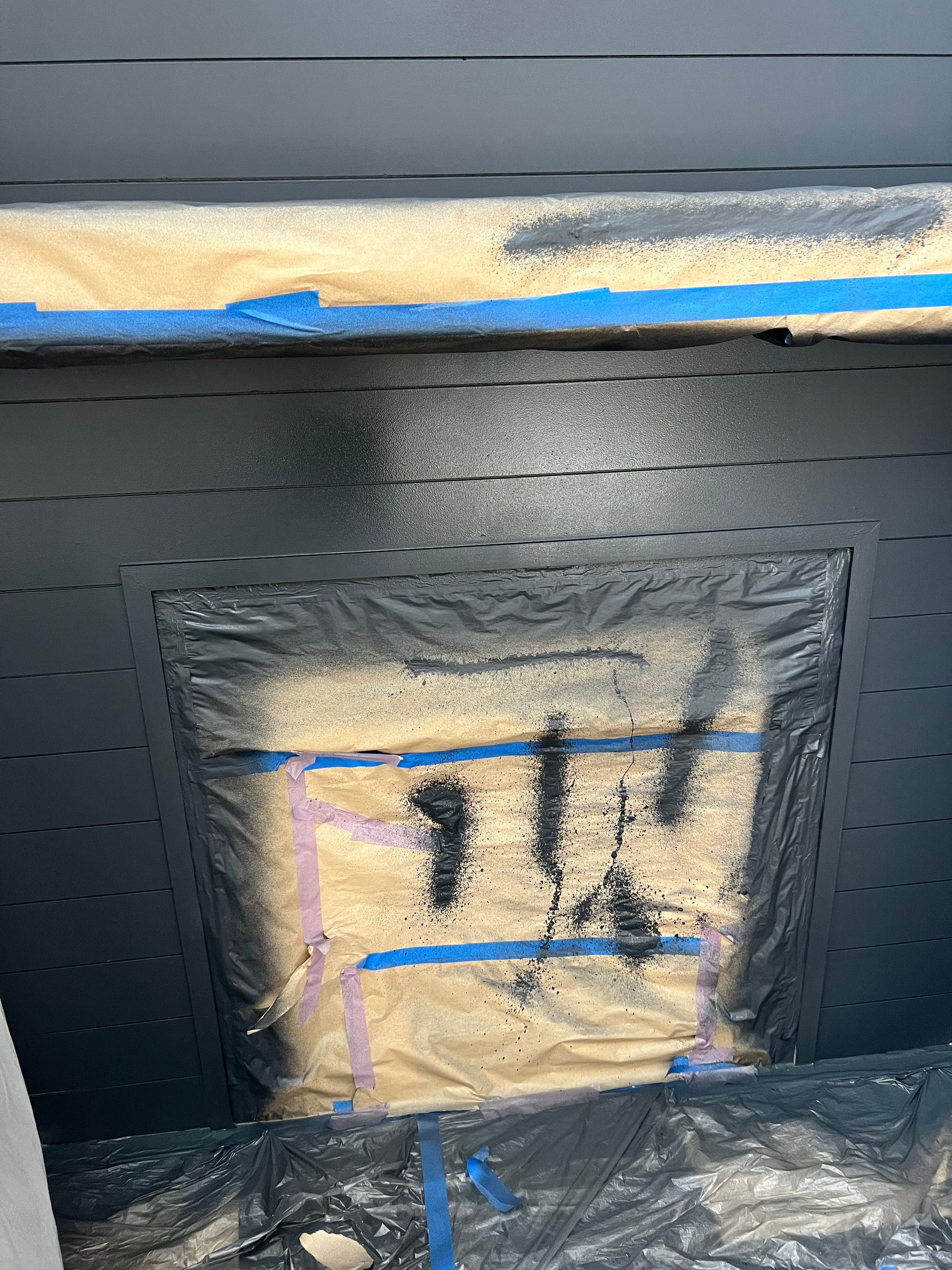 A piece of plastic is taped to a wall.