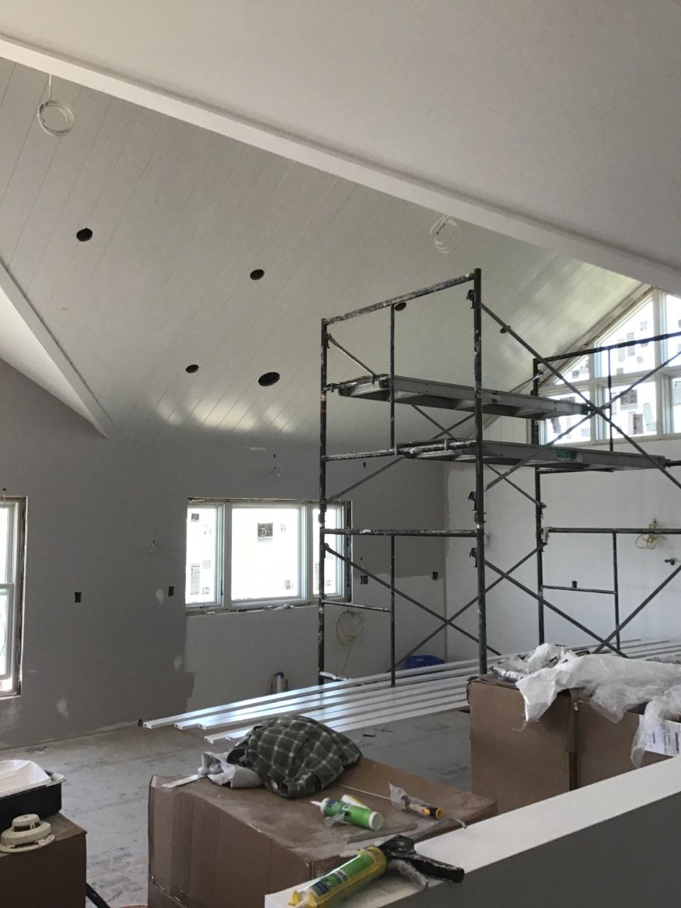 A large room with a scaffolding in the middle of it