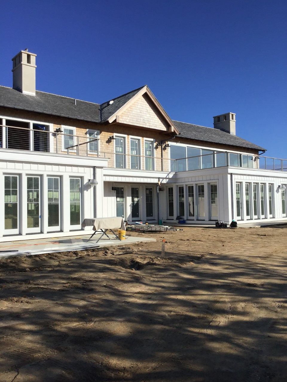 A large house with a lot of windows is being built