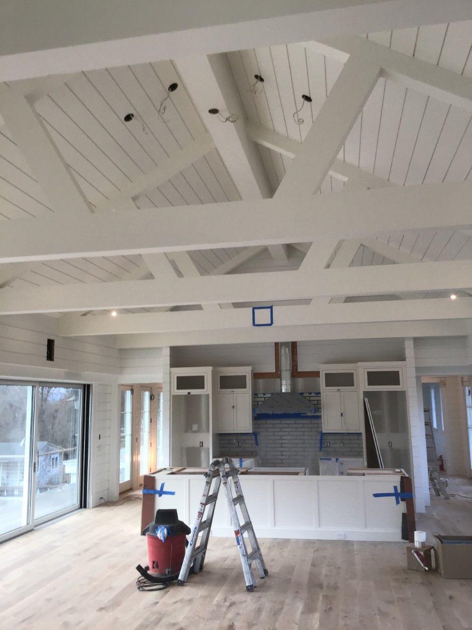 A large room with a ladder in the middle of it