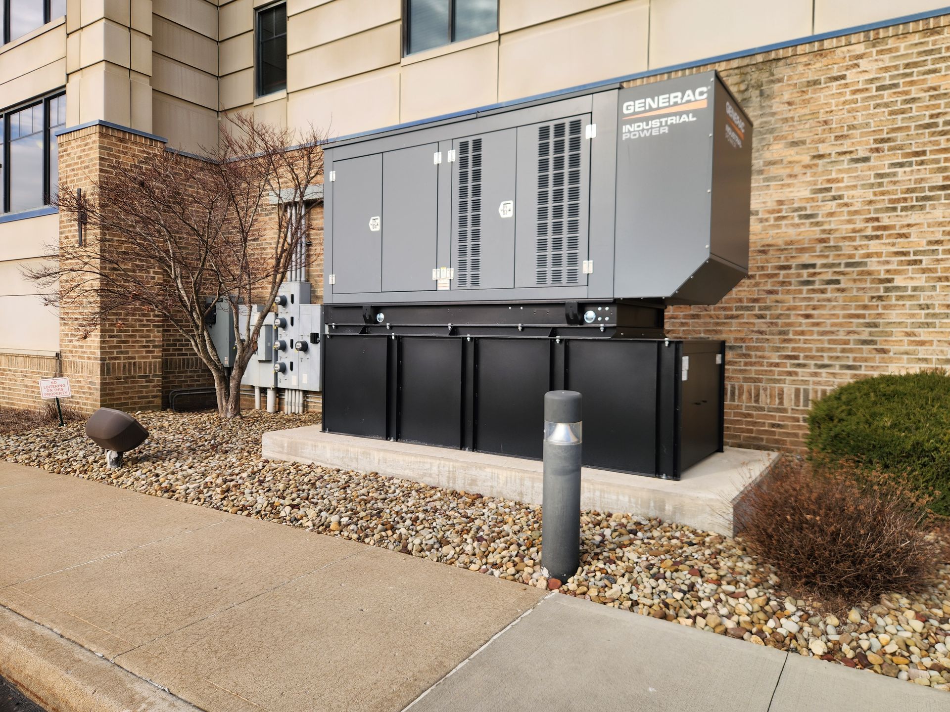 Two construction workers are working on the ceiling of a building.