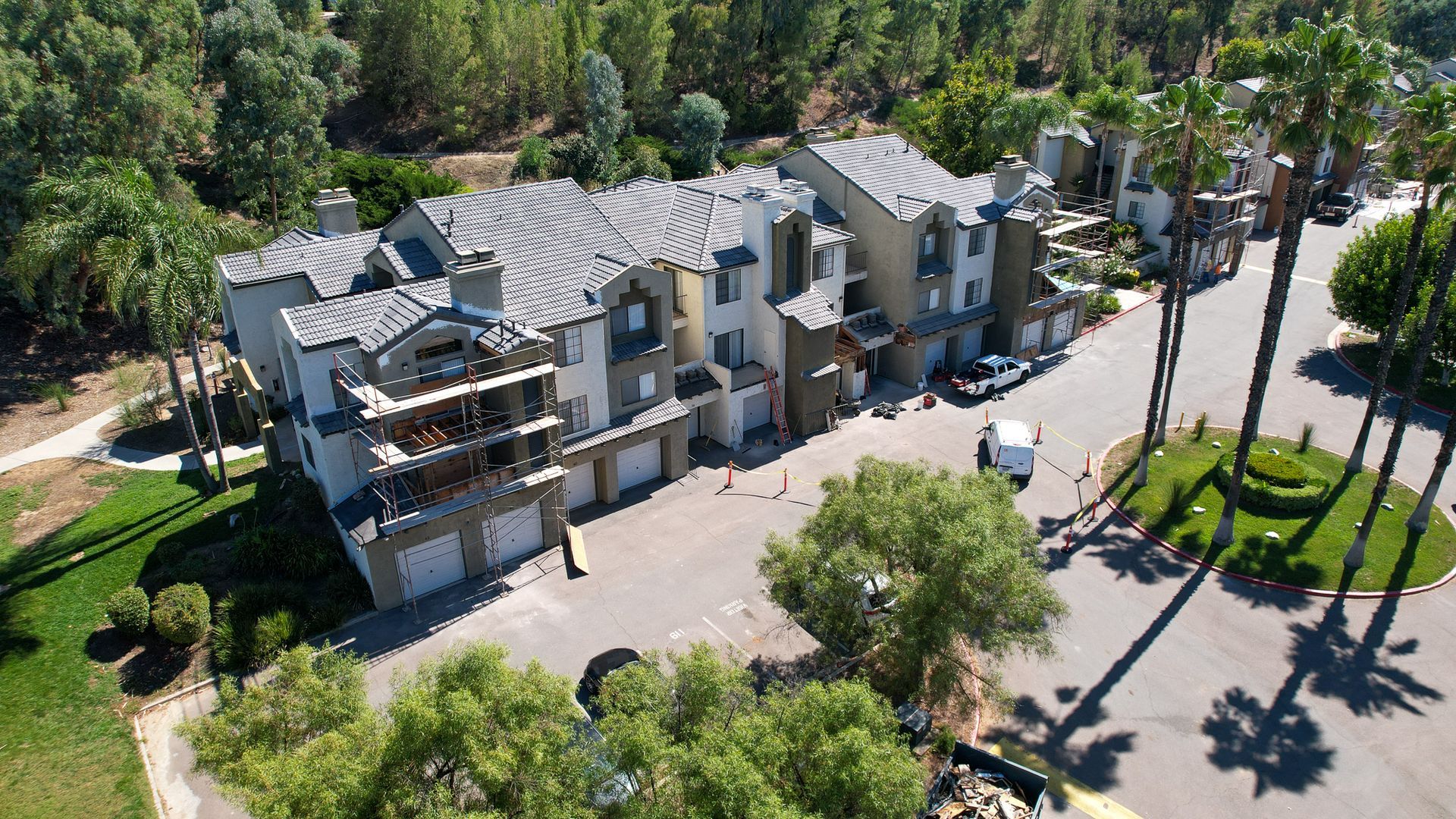 an aerial view of a residential area with a building under construction