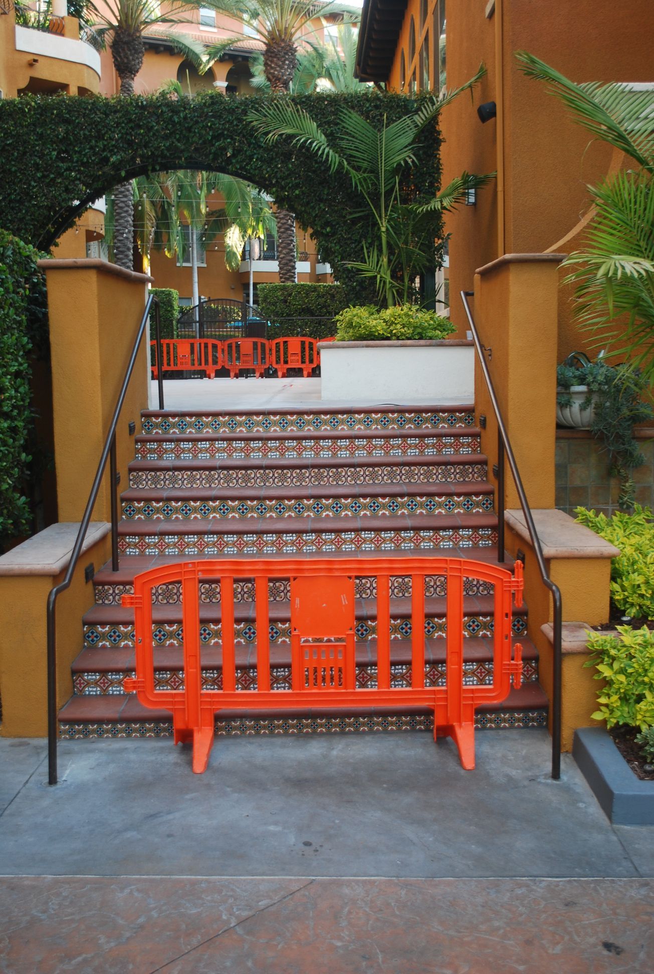a set of stairs with a orange barrier in front of them