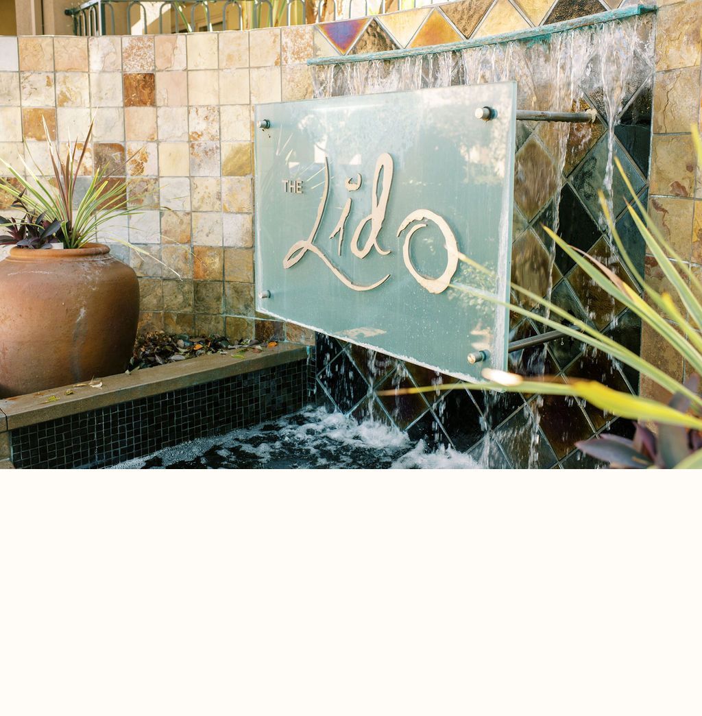 A waterfall with a sign that says ' lilo ' on it
