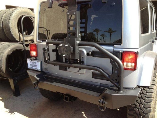 A silver jeep with a california license plate