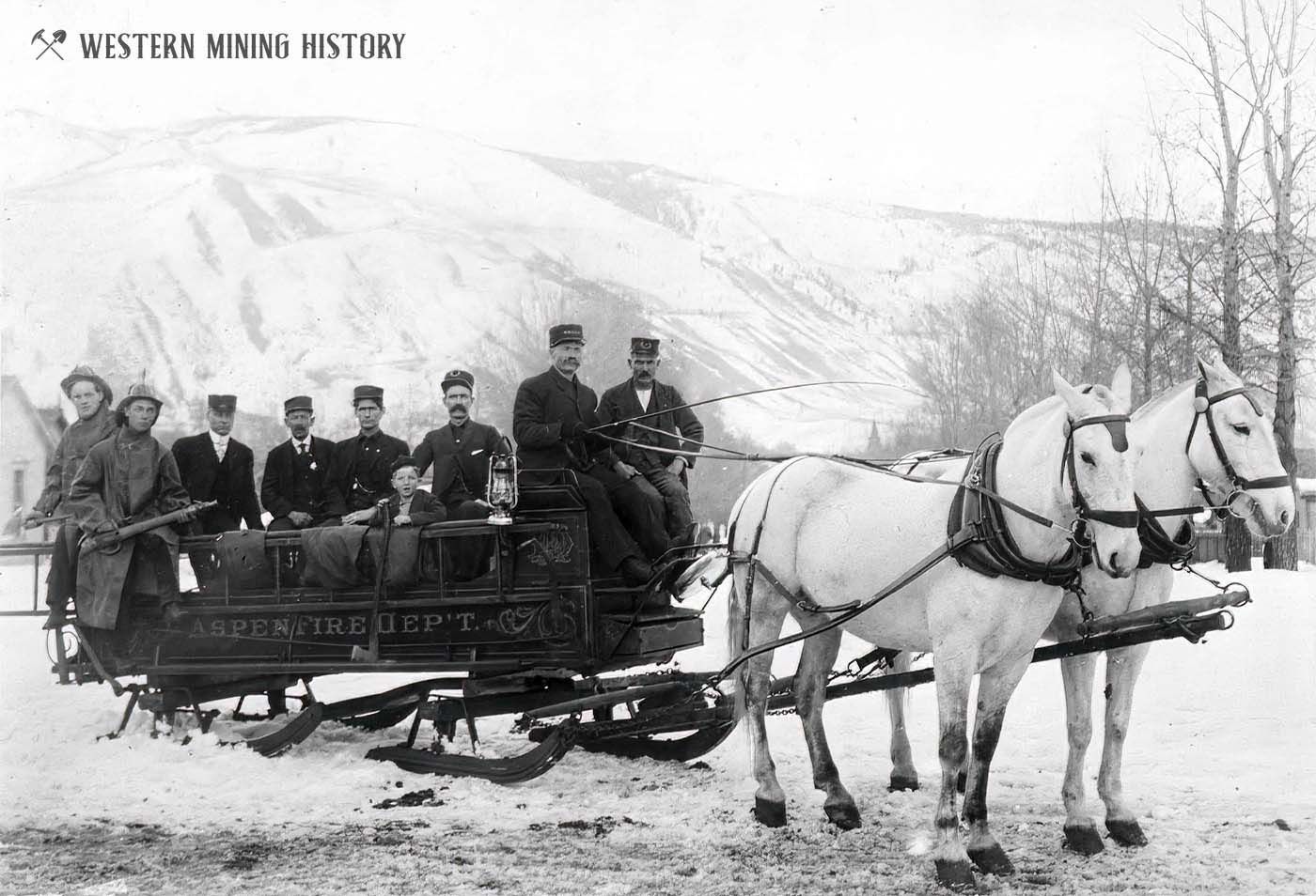 A group of men are riding in a horse drawn carriage.