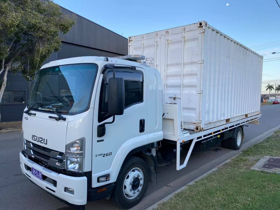 White Isuzu Truck With a White Cargo Container — Hot Shots 2 U In Townsville, QLD