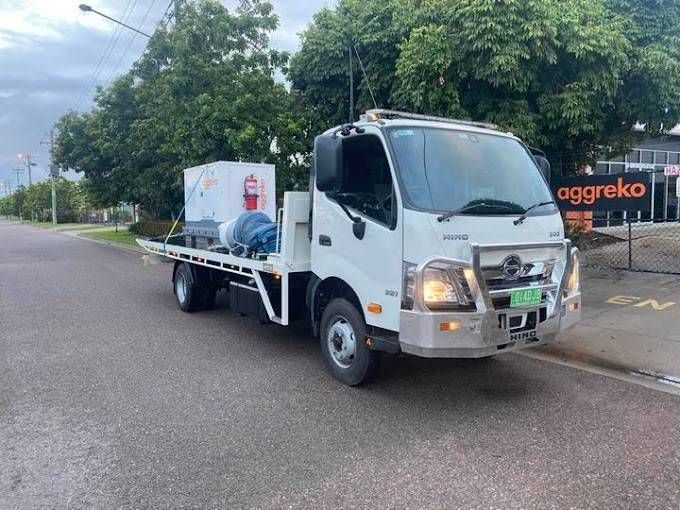 White Hino Flatbed Truck Carrying Equipment Parked on a Road — Hot Shots 2 U In Townsville, QLD