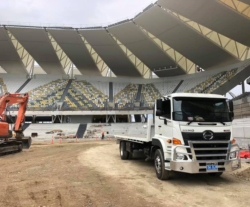 A White Truck Is Parked in Front of A Large Stadium — Hot Shots 2 U In Townsville, QLD