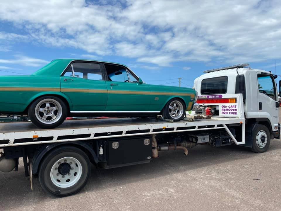 Green Classic Car on a Flatbed Tow Truck, Parked on a Sunny Day — Hot Shots 2 U In Townsville, QLD