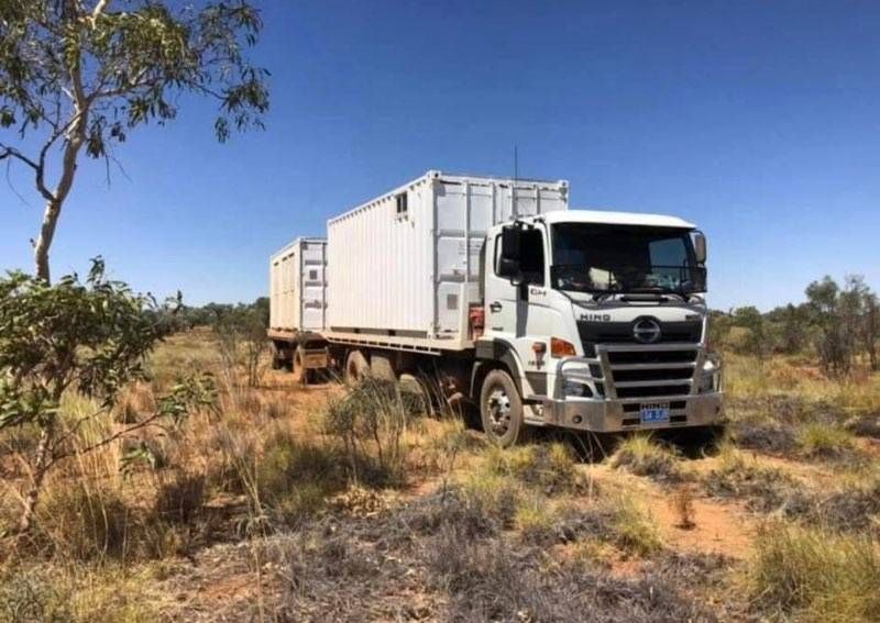 A White Hino Truck Hauling White Shipping Containers — Hot Shots 2 U In Townsville, QLD