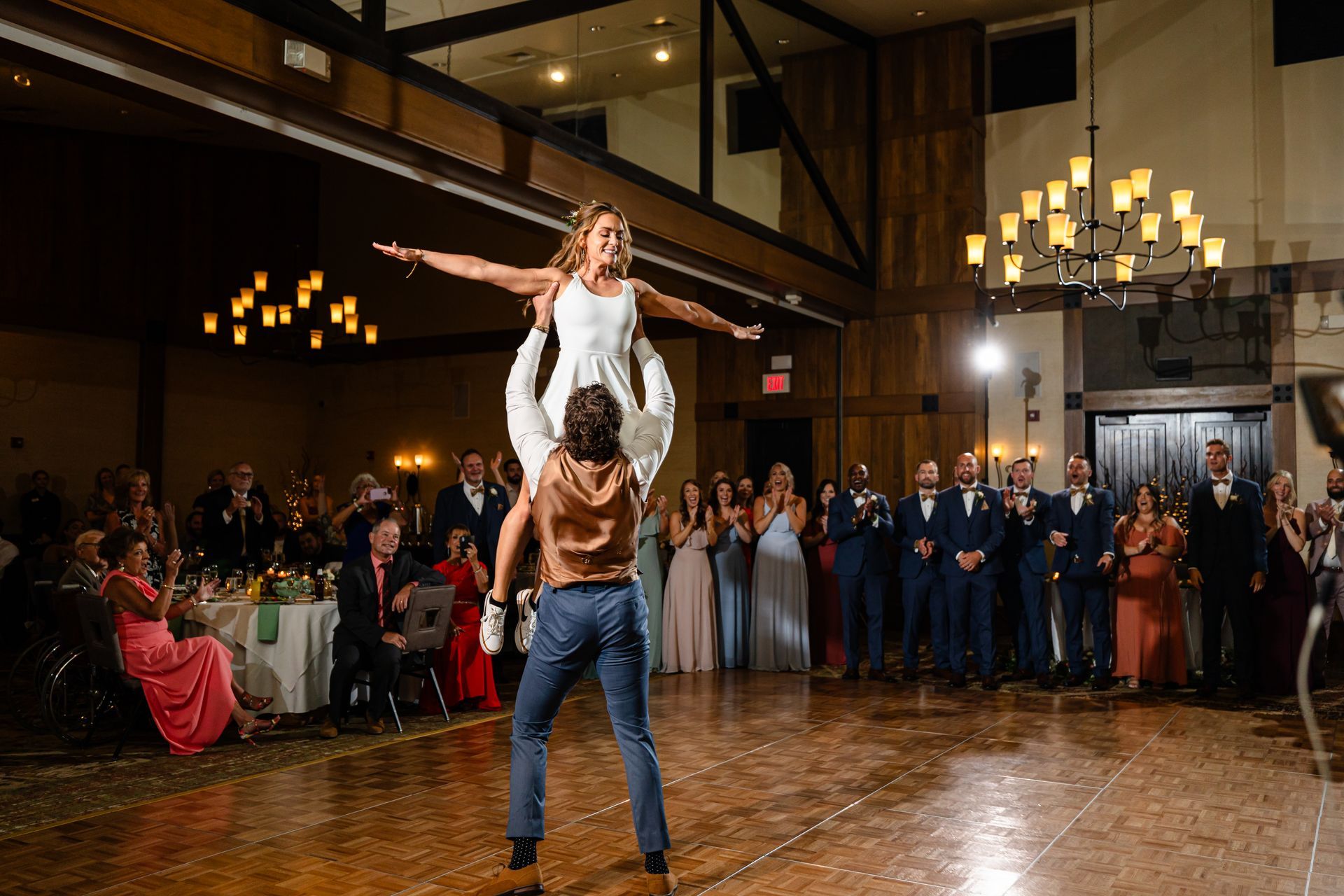 A bride and groom are dancing on a dance floor at their wedding reception taken by Ever After Studio.