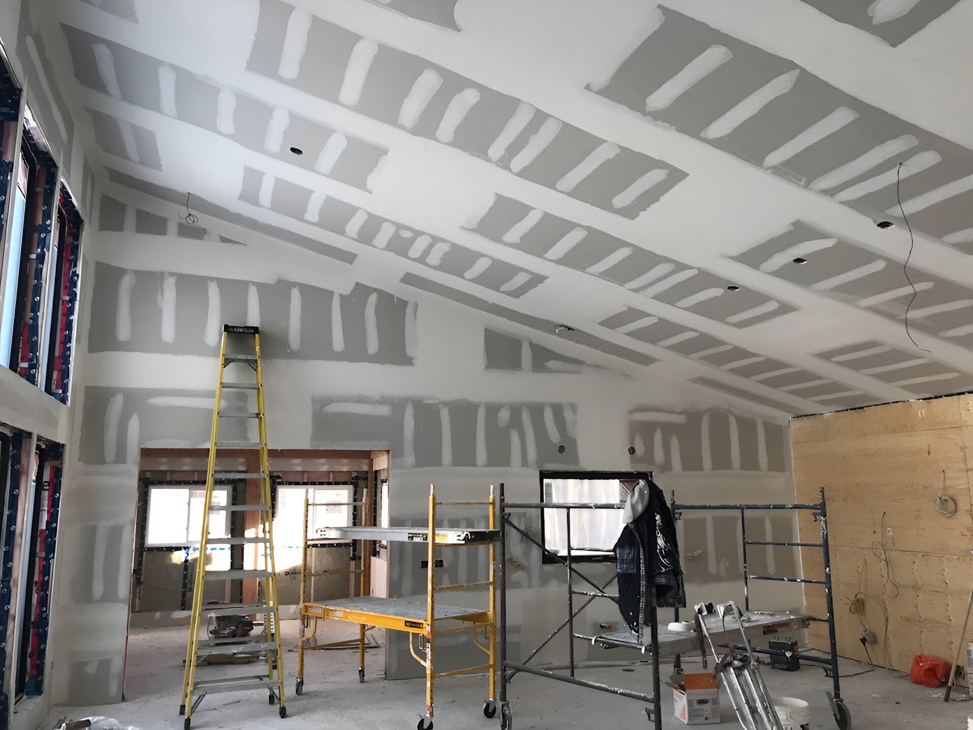 A room with a ladder and scaffolding in it