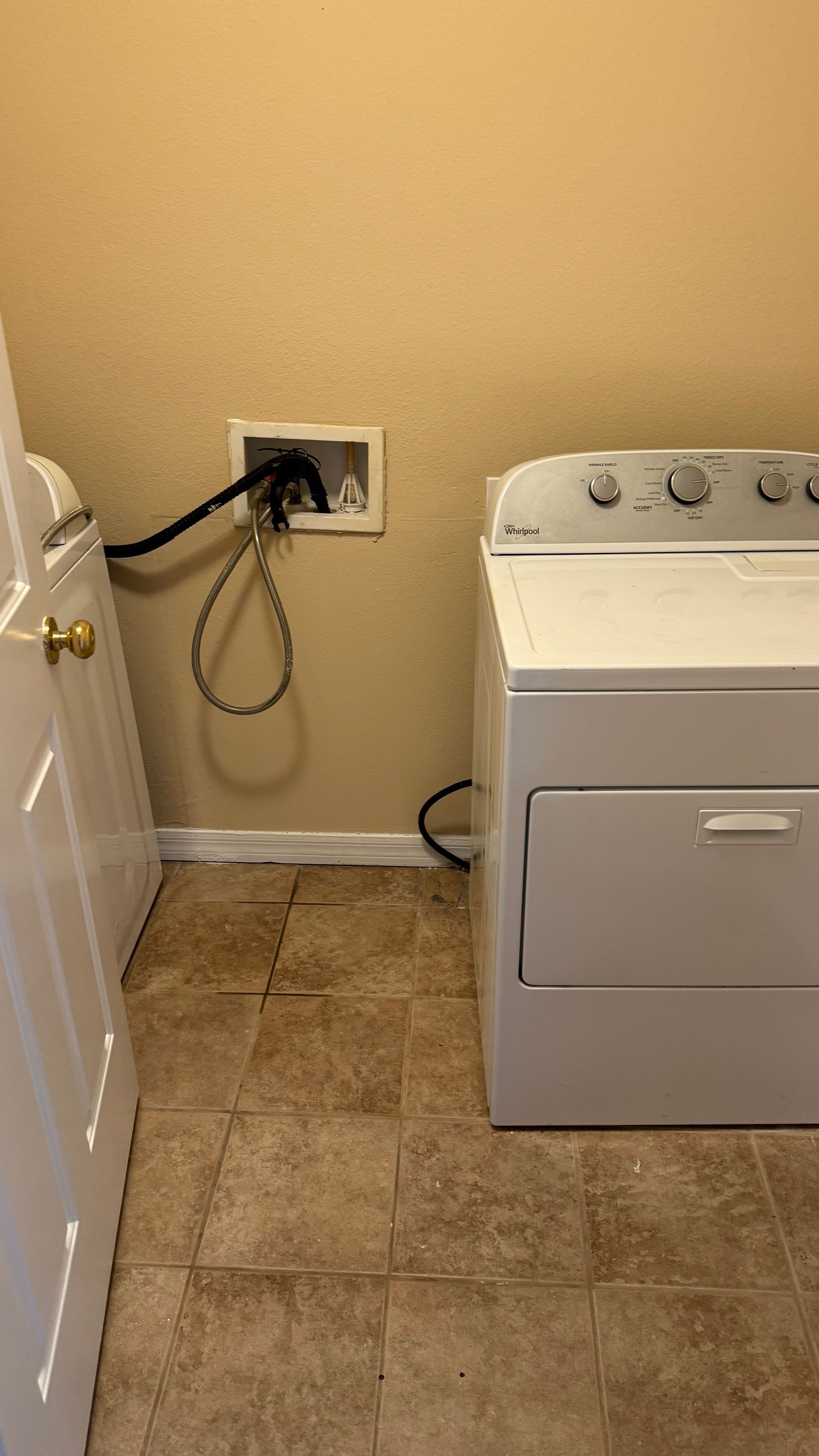 There is a washer and dryer in the laundry room.