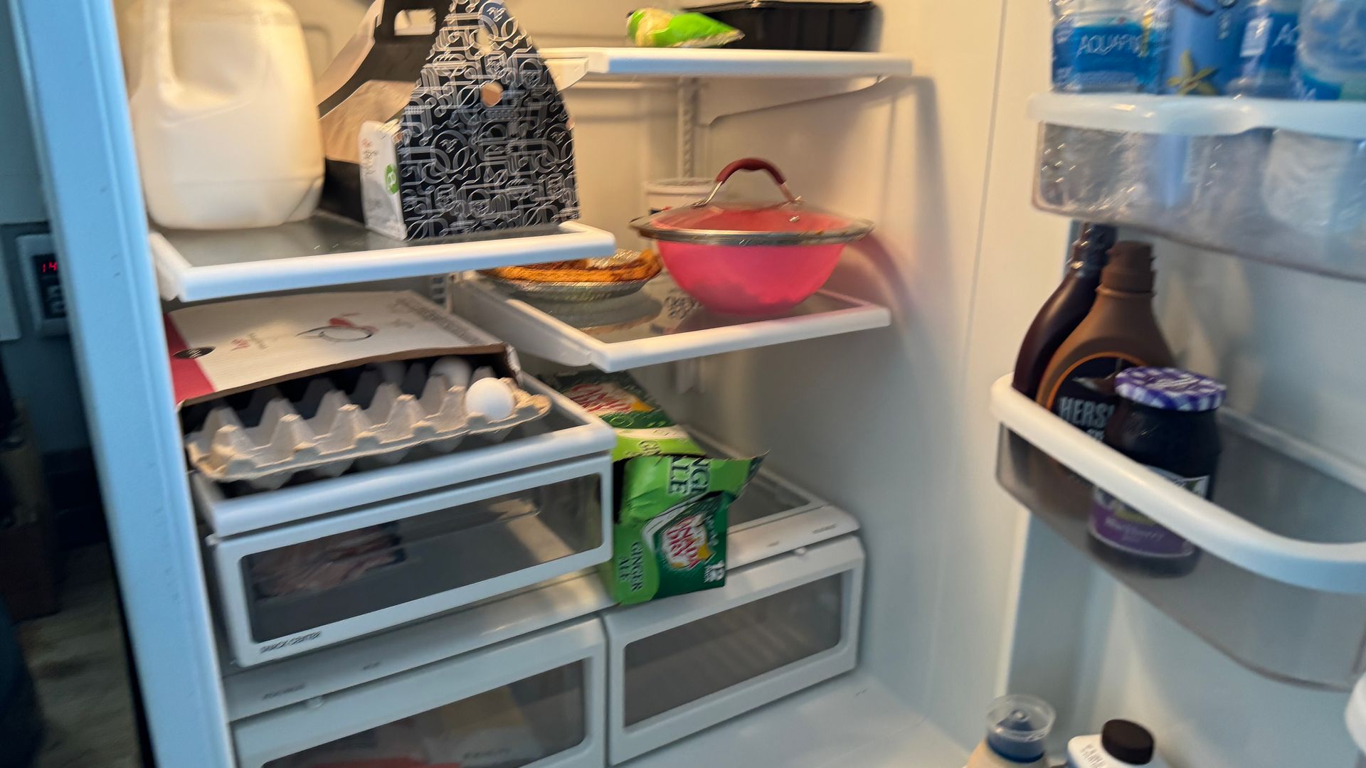 A refrigerator filled with lots of food and drinks.