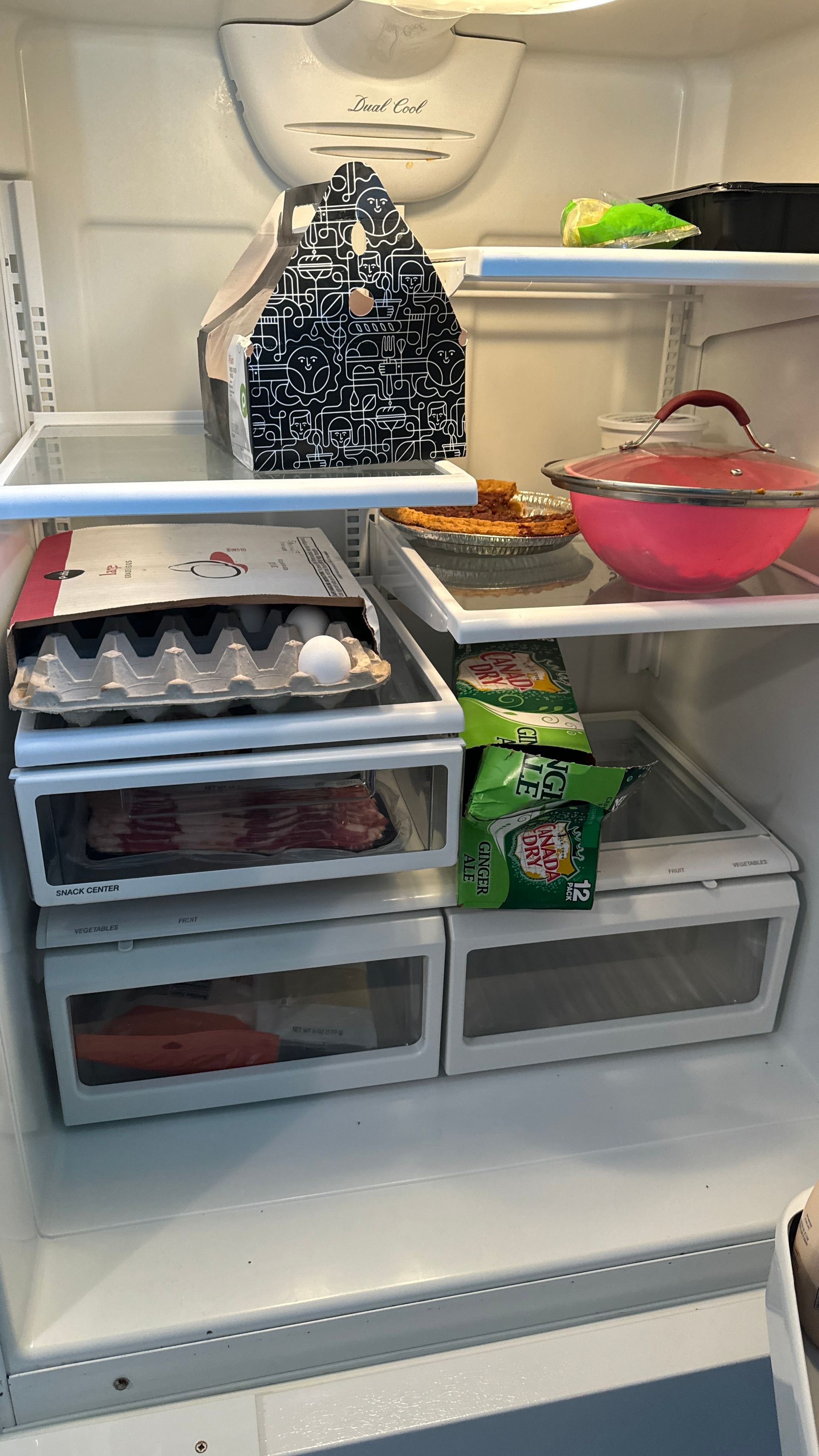 The inside of a refrigerator filled with lots of food.