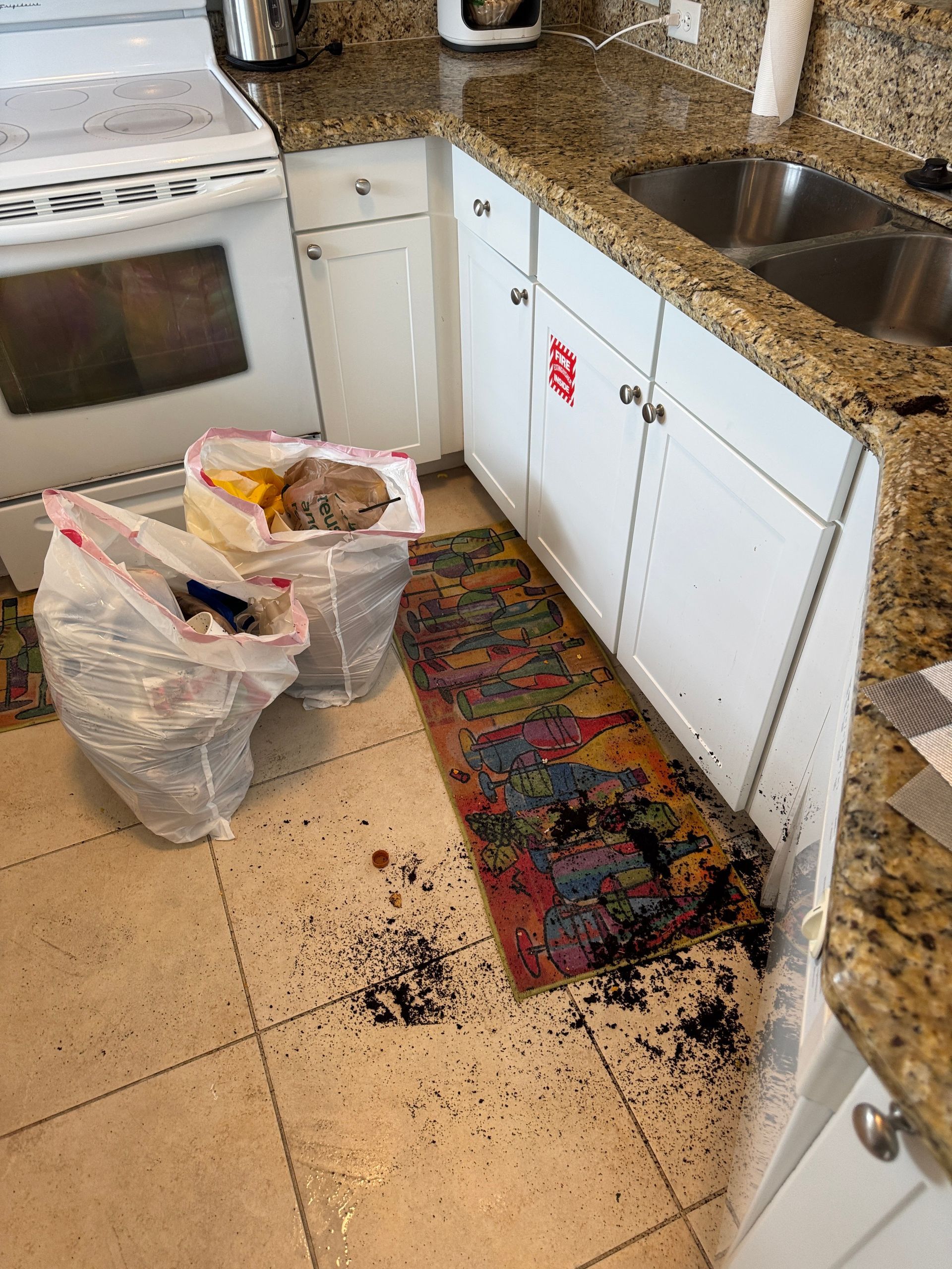 A kitchen with a rug that says ' dirty ' on it