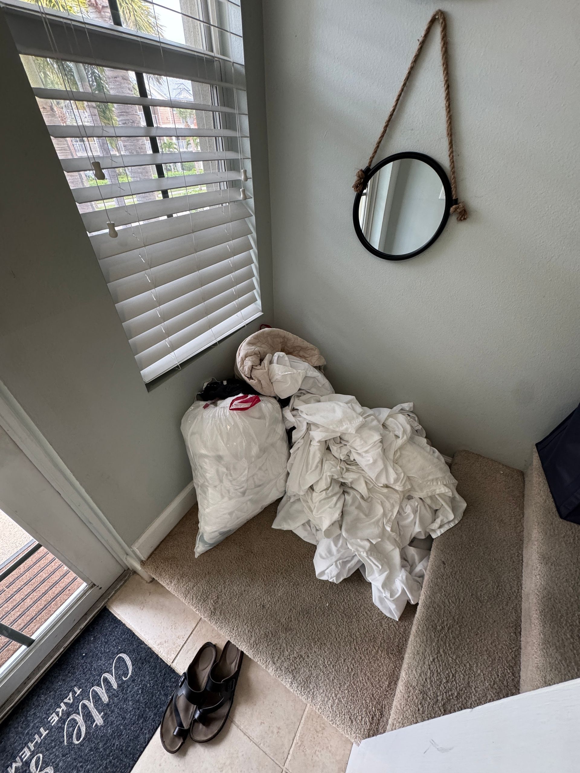 A room with a mirror and a door that says ' cutie ' on it