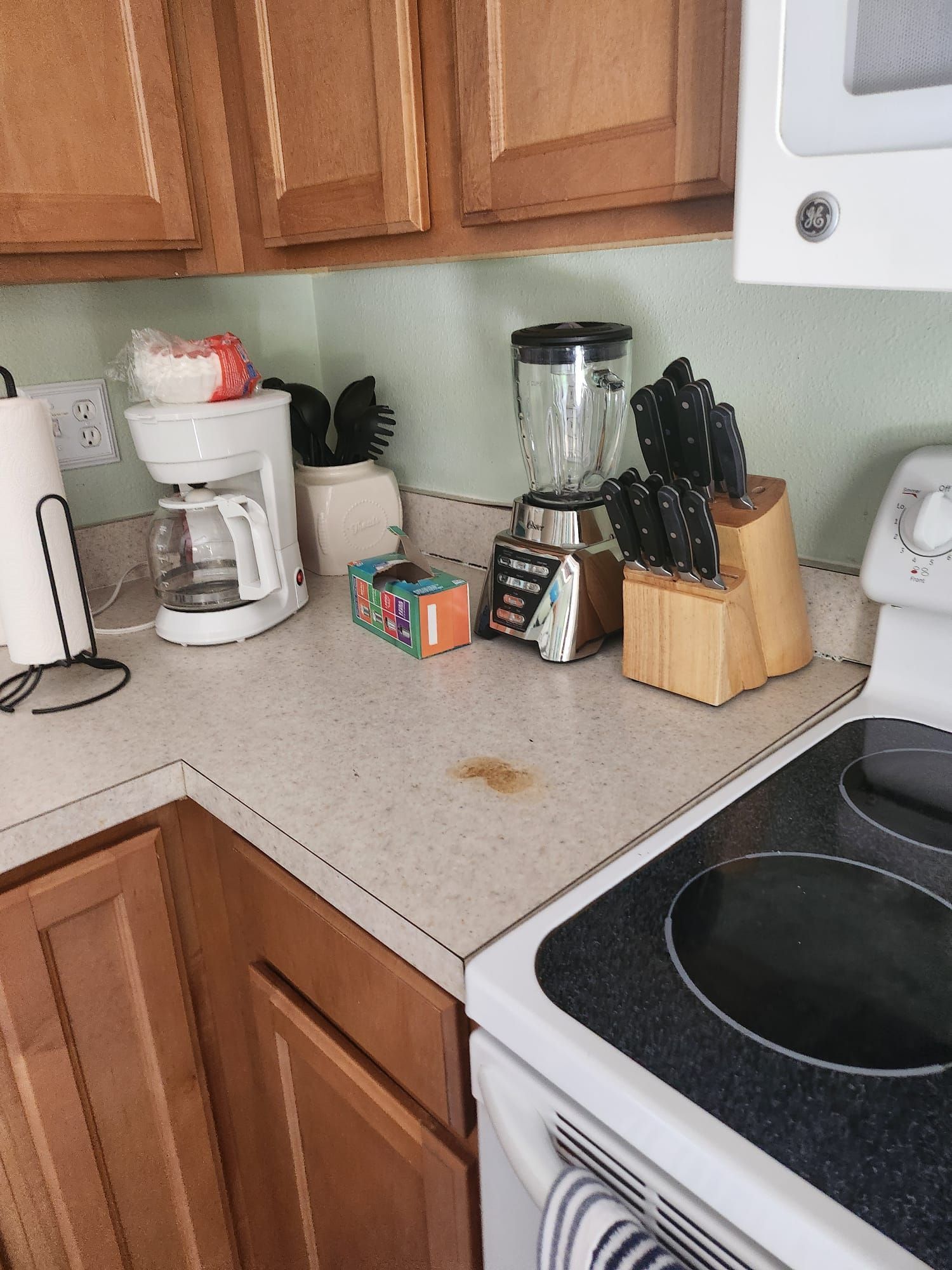 A kitchen with a microwave a coffee maker