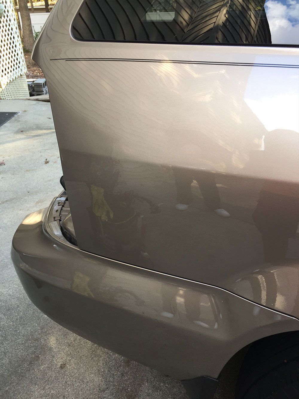 A close up of a car 's bumper and rear window