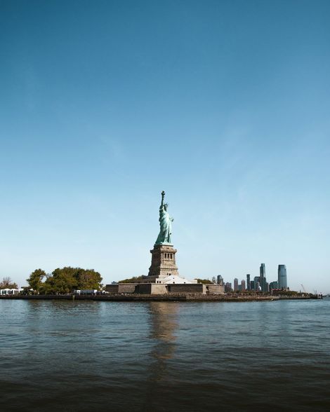 People walking across a city street, representing community served by personal injury & civil rights attorney.