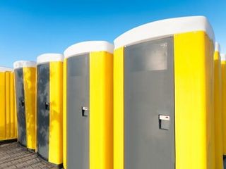 Yellow Portable Toilet — Plumbing Company in North Adams, MA