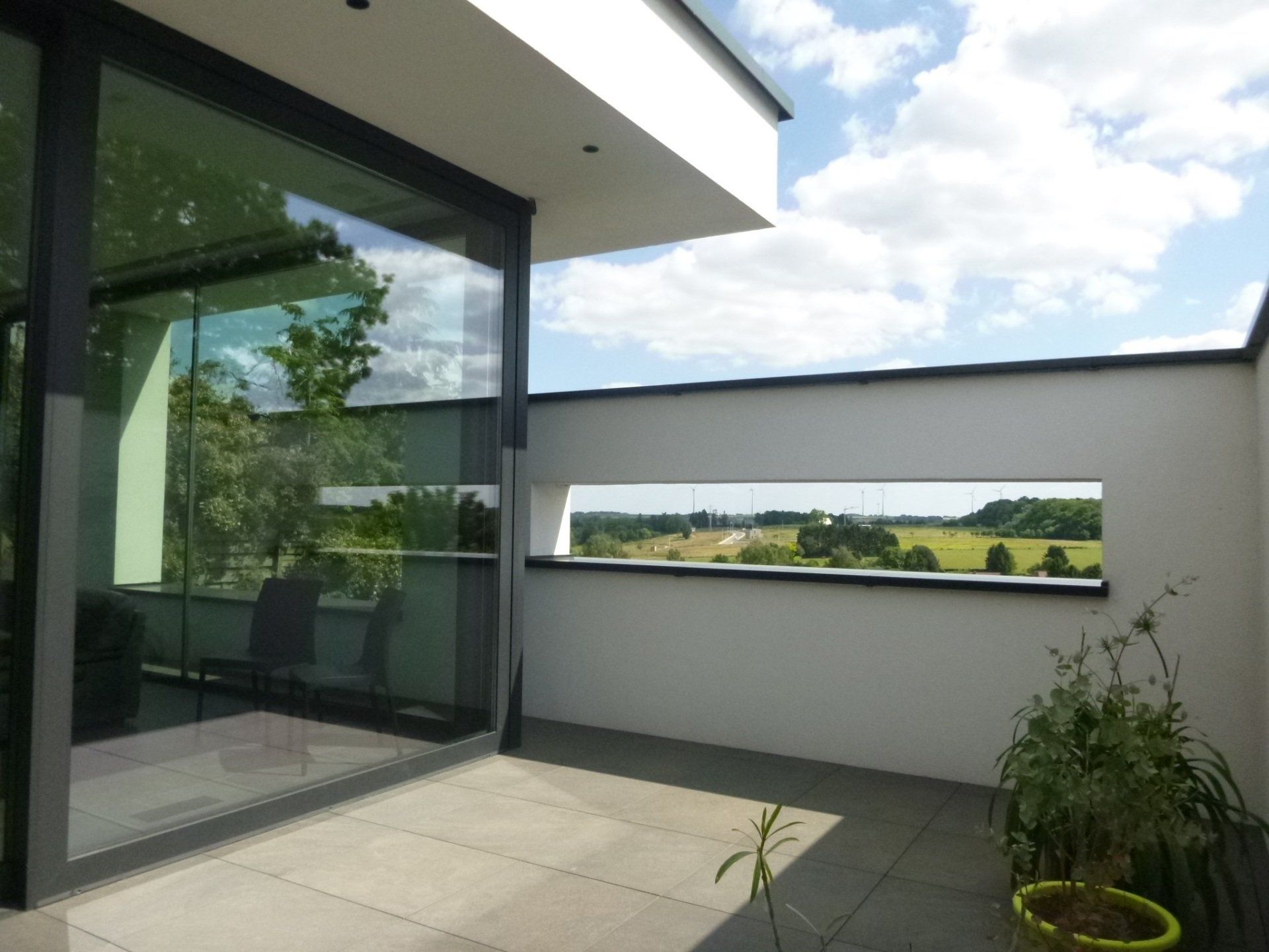 Moderne crepi woning met thuiskantoor en inpandig terras  in Diest - terras - Architectengroep Janssens