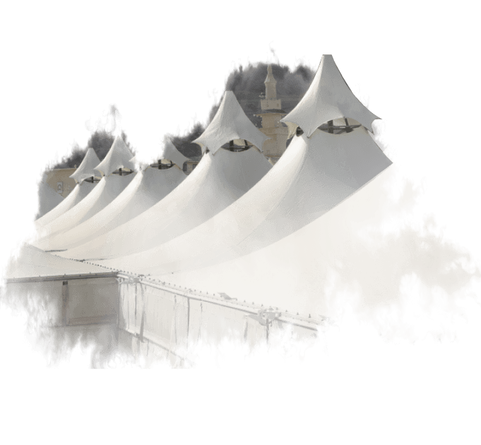 A row of white tents are sitting on top of a building.
