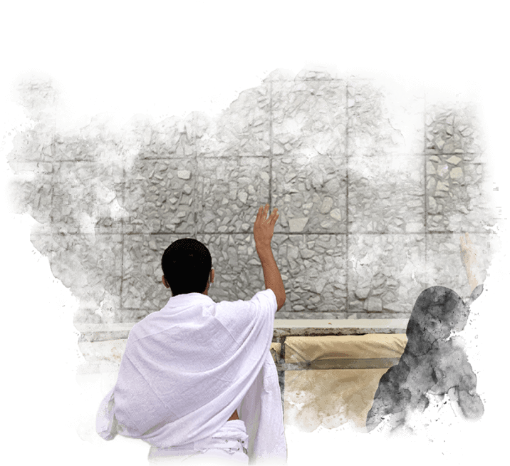 A man in a white robe is standing in front of a stone wall.