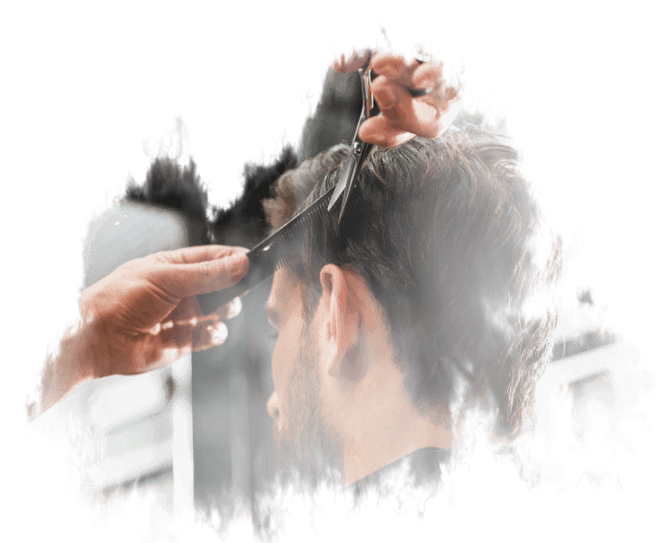A man is getting his hair cut at a barber shop.