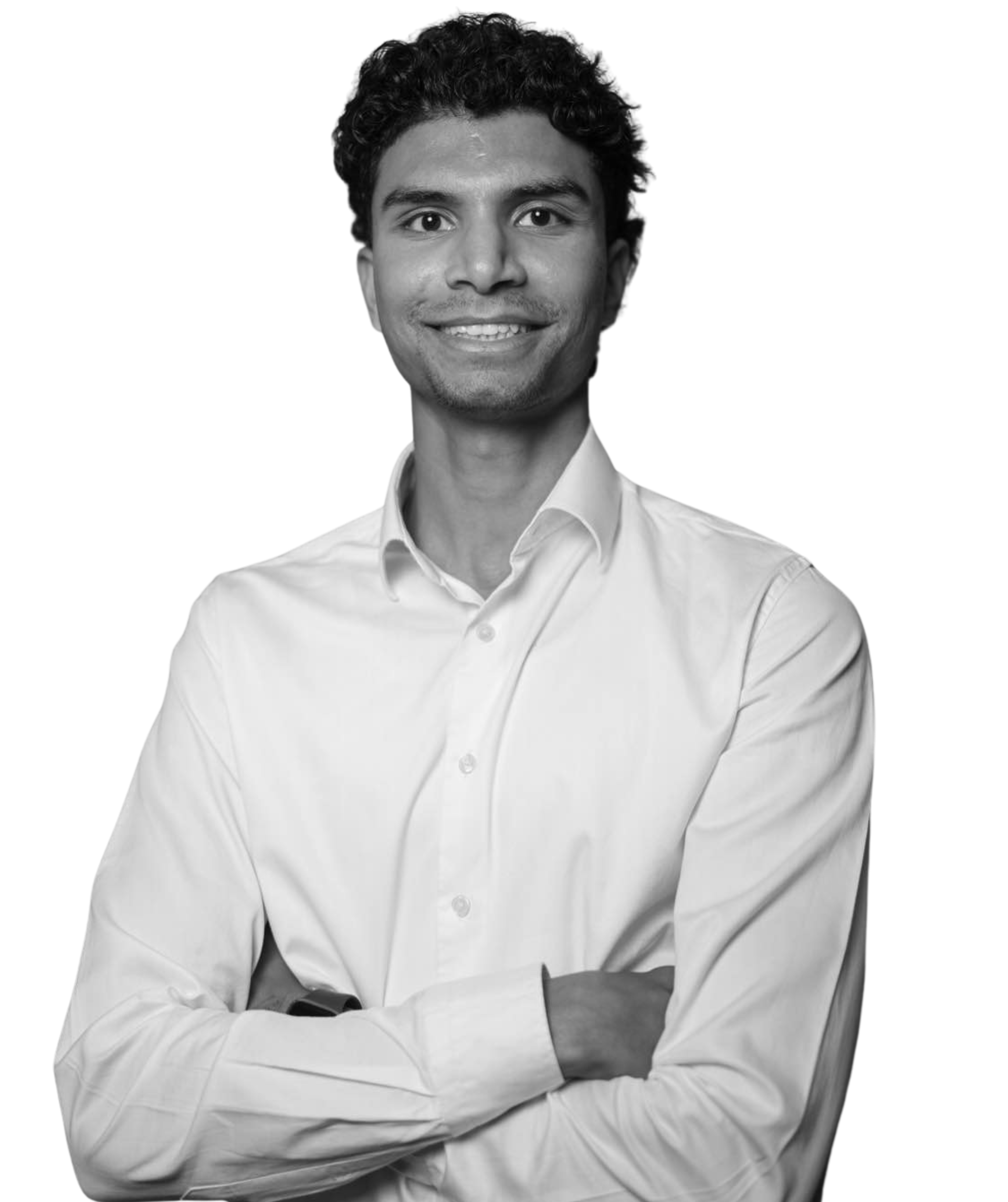 Man in white shirt with arms crossed, smiling.
