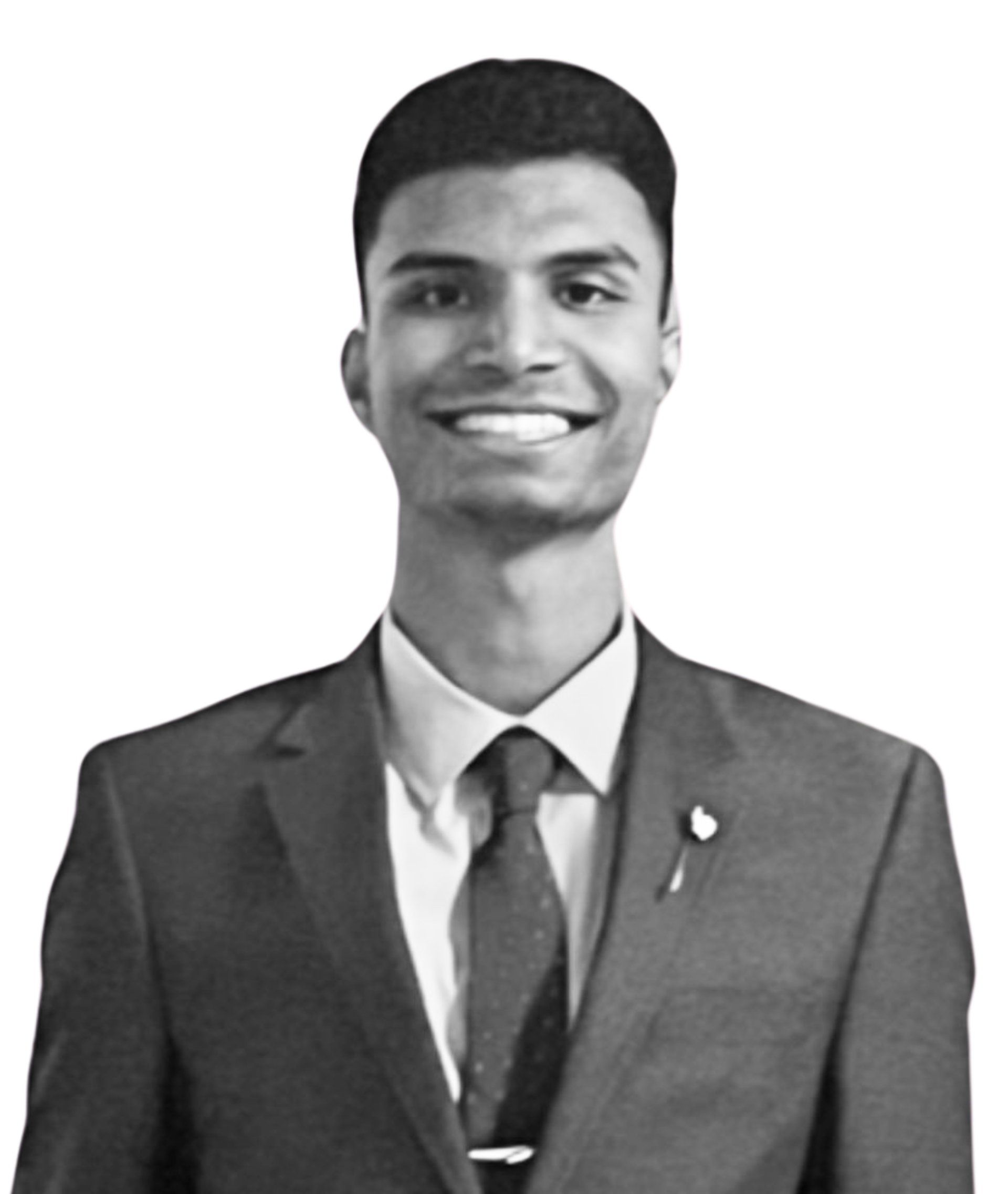 A man in a suit and tie is smiling in a black and white photo