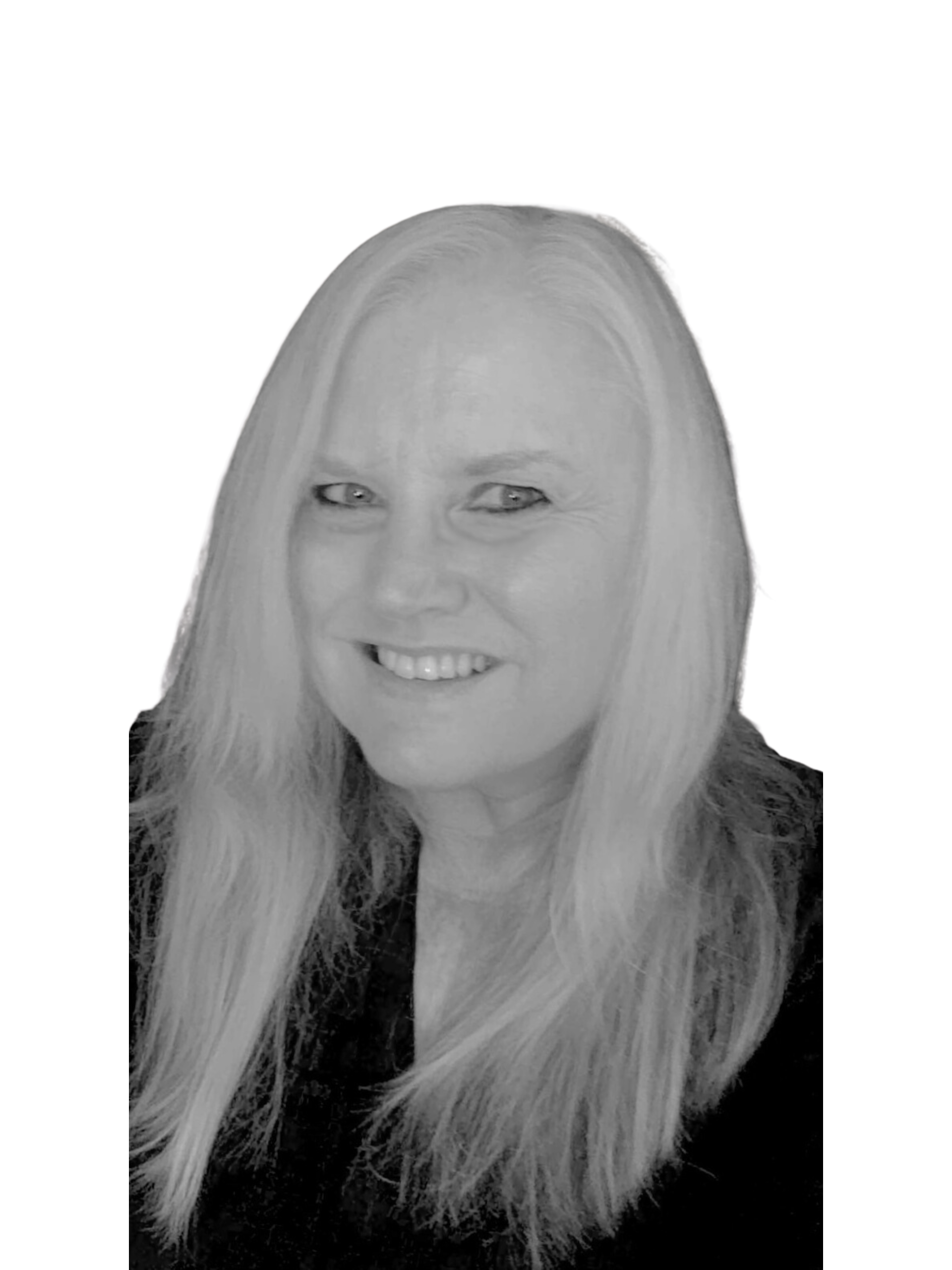 A woman with curly hair is smiling in a black and white photo.