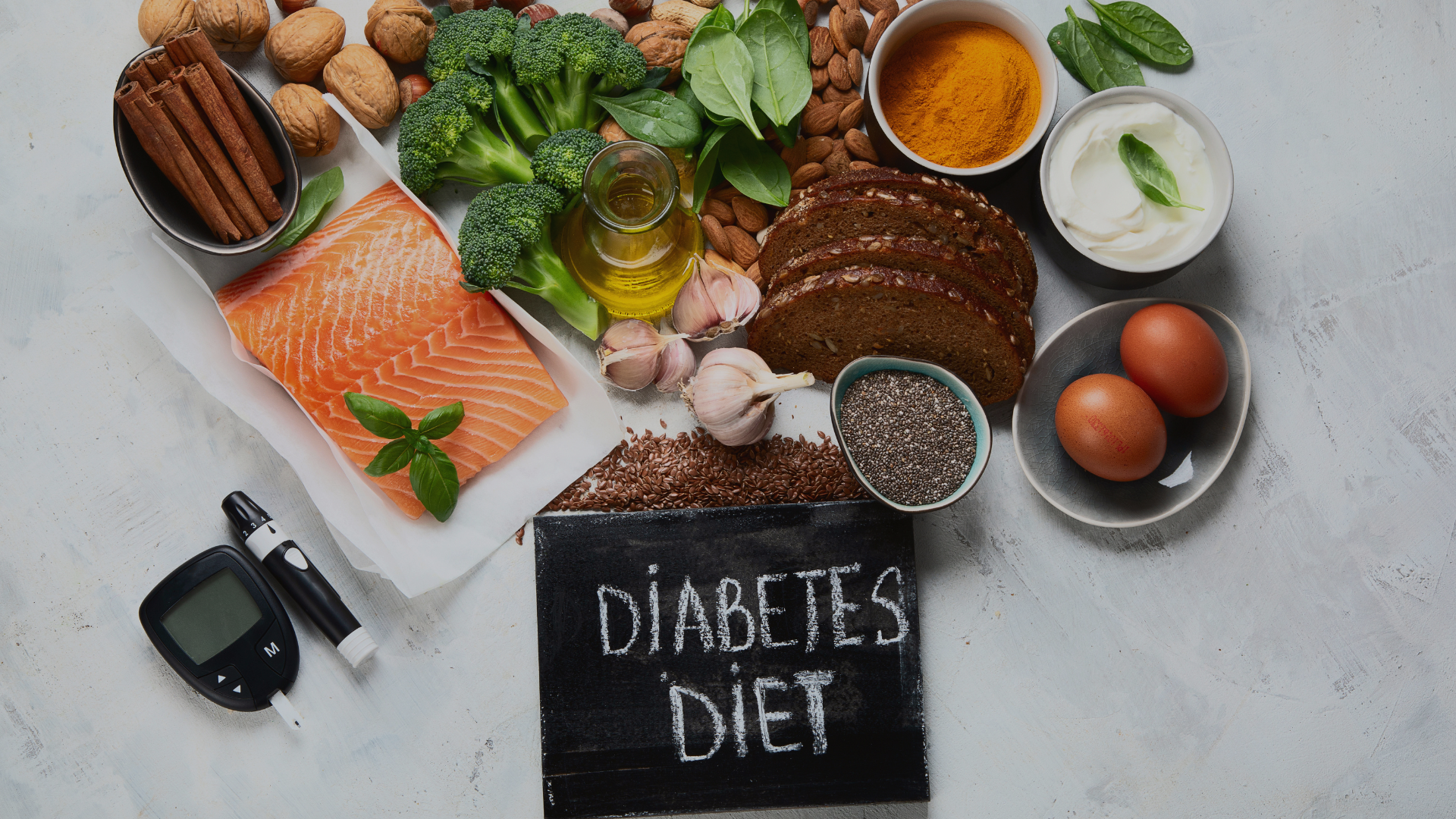 A table topped with plates of food and a sign that says diabetes diet.
