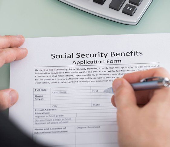 Signing Social Security Form — Orangeburg, SC — Dean Law Firm